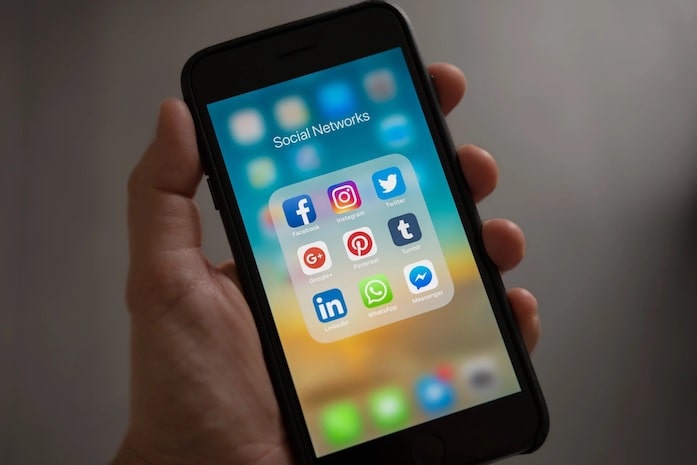 A folder of social network apps on an mobile phone