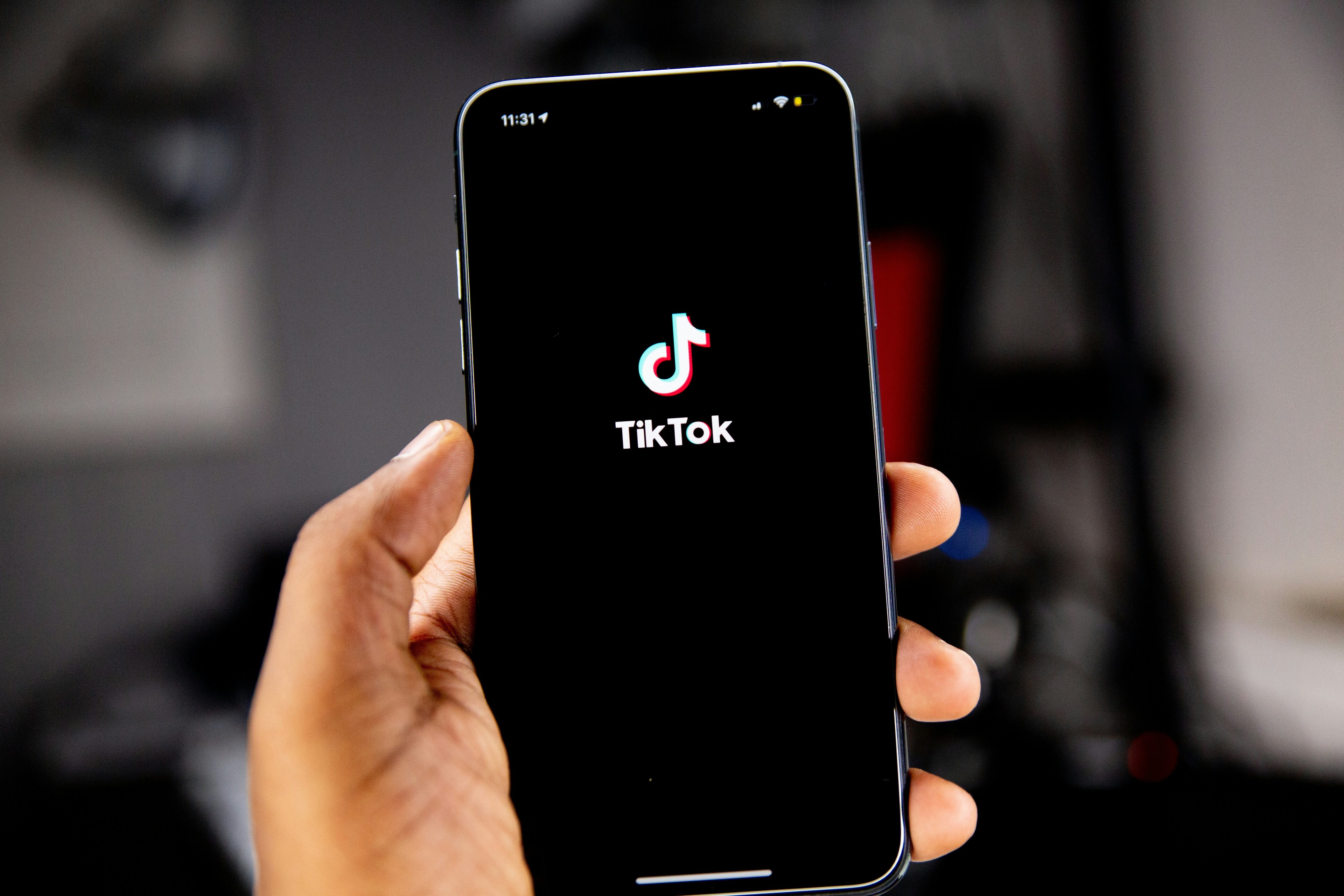 A phone showing the TikTok welcome screen